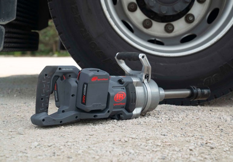 Torque Tool Hire demonstration with an Ingersoll Rand tool. Set next to a heavy vehicle outdoors, the torque tool is ready.