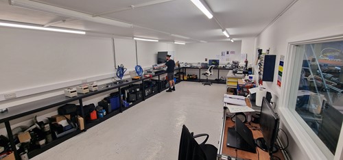 A Torque Wrench calibration room that is clean and tidy. worker at Applied Torque calibrating wrenches.